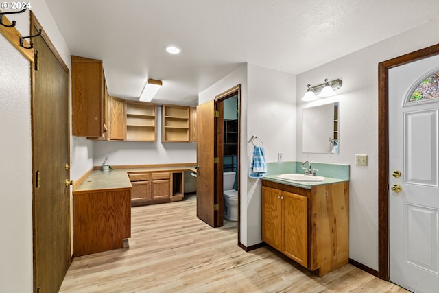 39145 Eagles Rest Rd, Dexter, OR 97431 - bathroom featuring toilet, baseboards, wood finished floors, and vanity