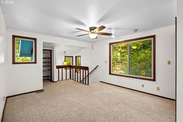 39145 Eagles Rest Rd, Dexter, OR 97431 - carpeted spare room featuring baseboards, visible vents, and ceiling fan