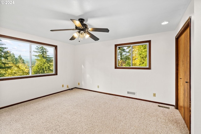 39145 Eagles Rest Rd, Dexter, OR 97431 - unfurnished bedroom with ceiling fan, carpet, baseboards, and visible vents