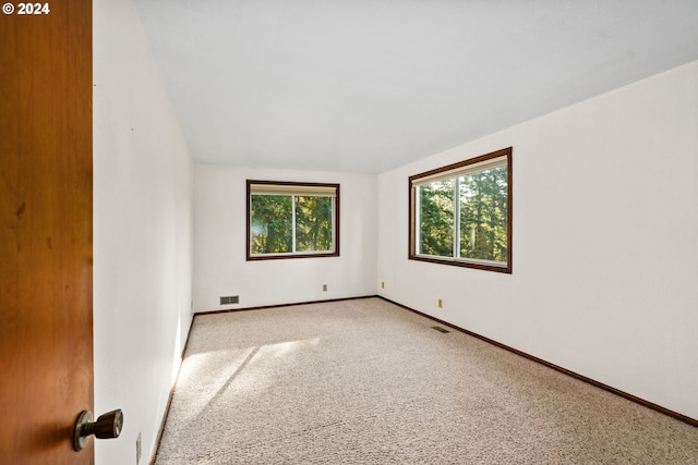 39145 Eagles Rest Rd, Dexter, OR 97431 - unfurnished room with a wealth of natural light, visible vents, baseboards, and carpet floors