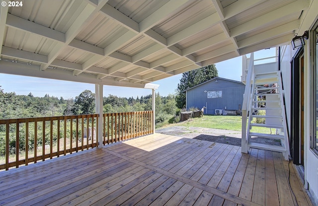 wooden deck with a yard