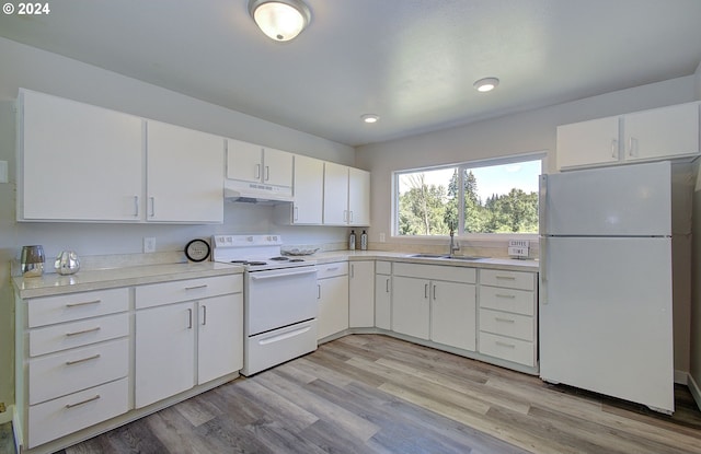 kitchen with sink, white cabinets, white appliances, and light hardwood / wood-style flooring