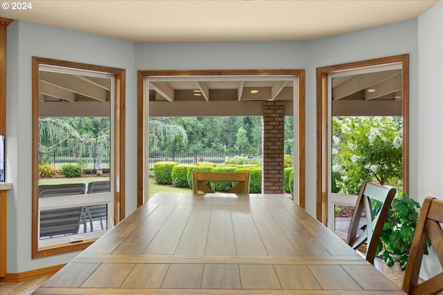 unfurnished dining area with brick wall