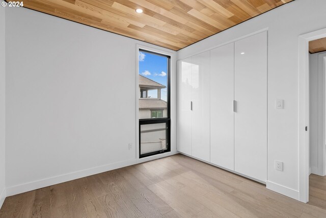 interior space featuring wooden ceiling and light hardwood / wood-style floors