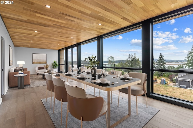 sunroom / solarium with wood ceiling and a healthy amount of sunlight