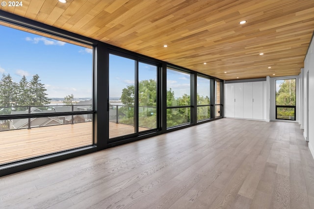 unfurnished sunroom featuring wooden ceiling