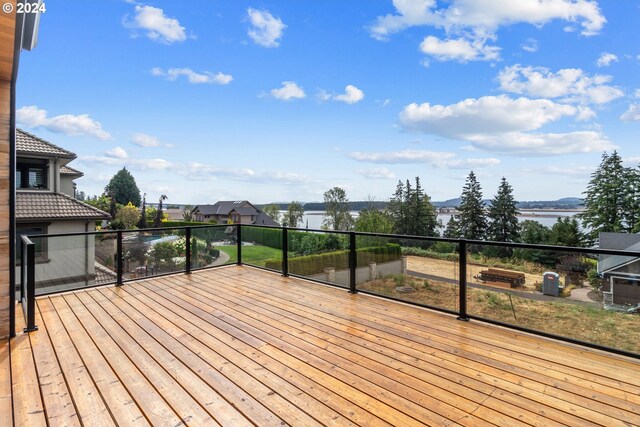 wooden deck featuring a water view