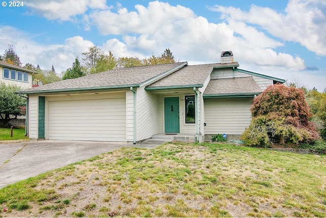 ranch-style house with a front yard and a garage