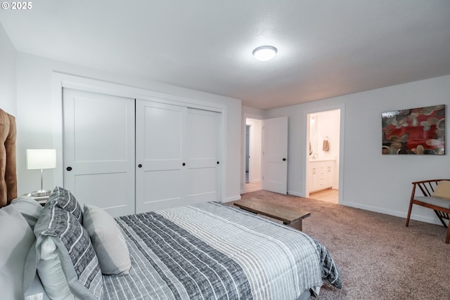 carpeted bedroom featuring connected bathroom and a closet