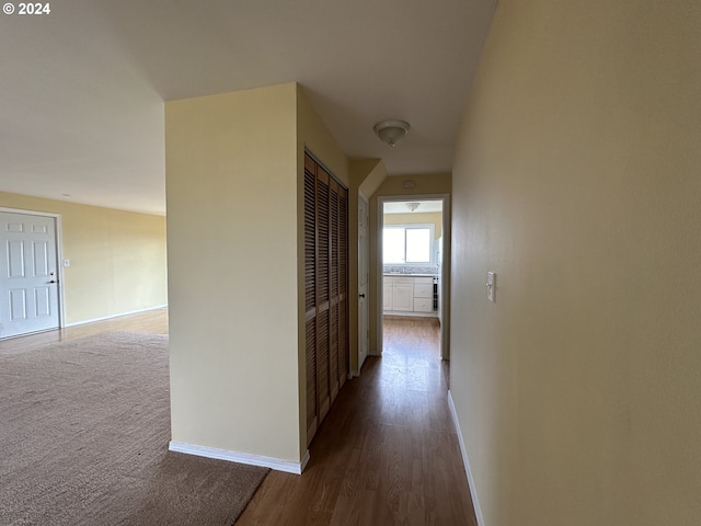 hallway featuring dark hardwood / wood-style floors