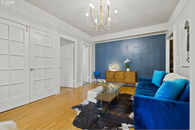 living room featuring a notable chandelier and hardwood / wood-style flooring