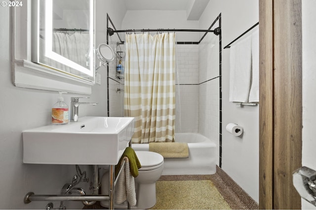 full bathroom featuring shower / tub combo with curtain, sink, and toilet