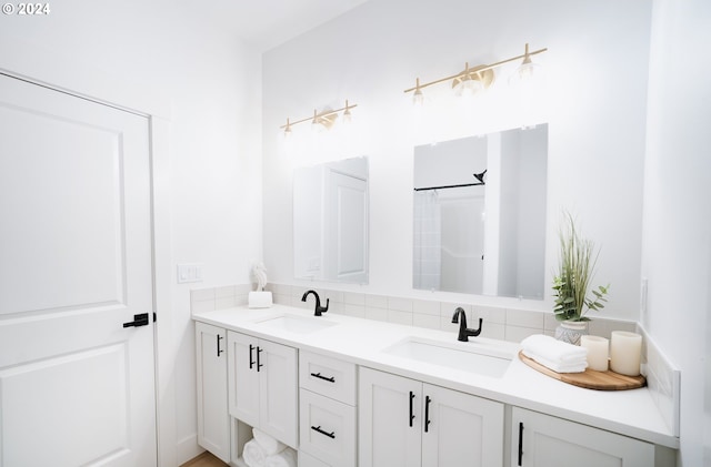 bathroom with decorative backsplash and double sink vanity