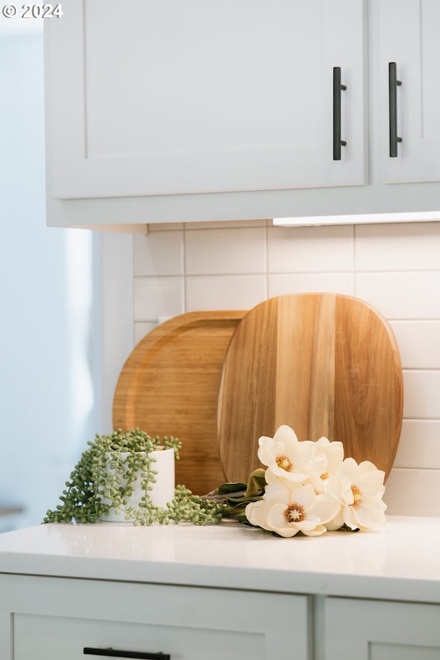 details featuring white cabinetry