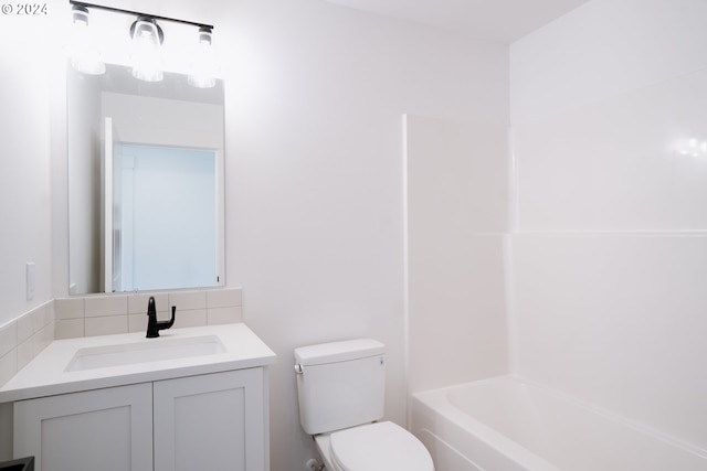 bathroom with decorative backsplash,  shower combination, vanity, and toilet