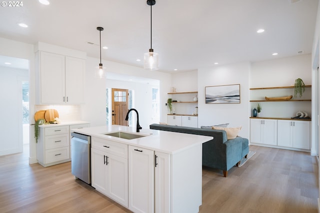 kitchen featuring sink, light hardwood / wood-style flooring, an island with sink, dishwasher, and white cabinets