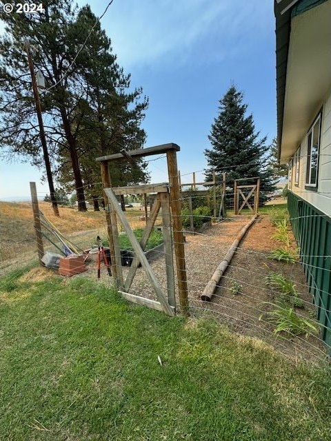 view of playground with a lawn