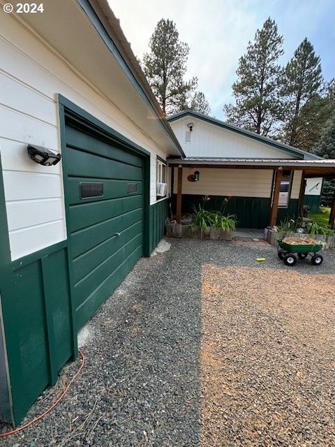 view of side of home featuring a garage