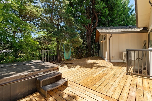 deck featuring a hot tub