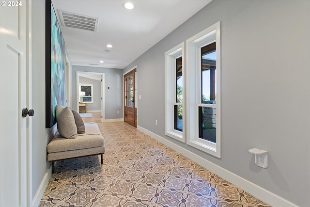 hallway with light tile patterned floors