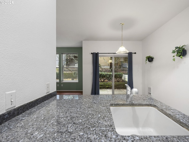 kitchen with sink and pendant lighting