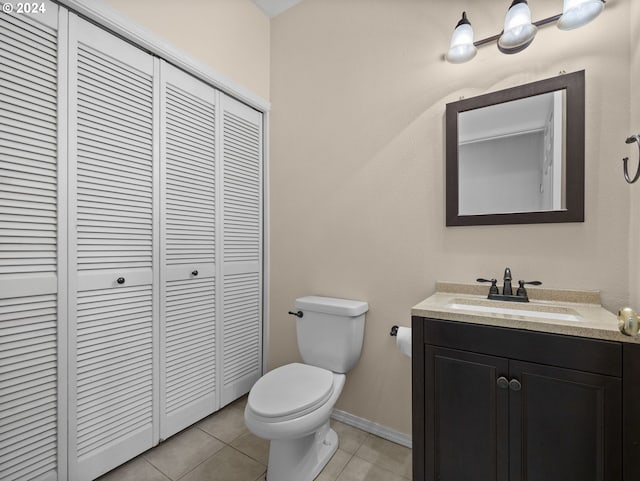 bathroom with tile patterned floors, vanity, and toilet