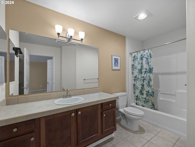 full bathroom with tile patterned flooring, vanity, toilet, and shower / bath combo with shower curtain