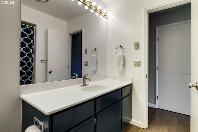 bathroom with vanity and hardwood / wood-style floors