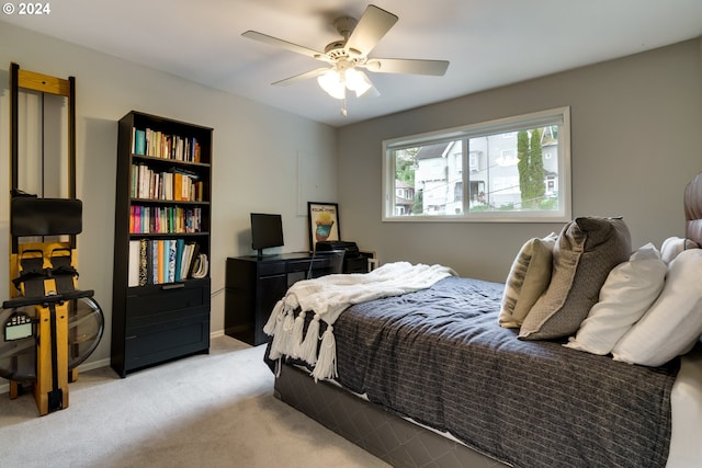 bedroom featuring ceiling fan and light colored carpet