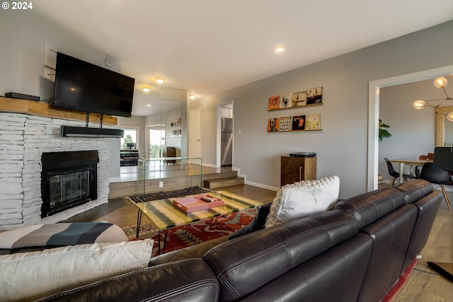 living room featuring hardwood / wood-style flooring and a fireplace