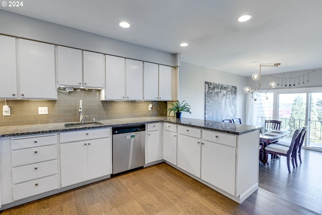 kitchen with kitchen peninsula, white cabinetry, dishwasher, and light hardwood / wood-style flooring