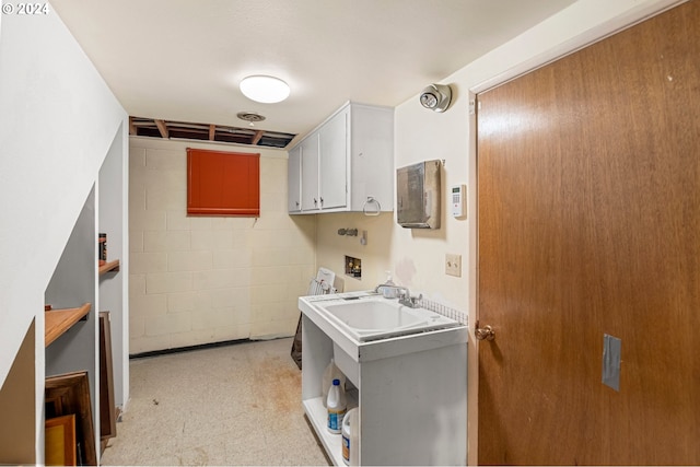 laundry area with cabinets, sink, and washer hookup