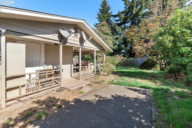 view of side of property with a lawn