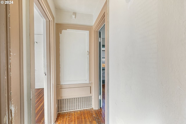 corridor featuring hardwood / wood-style floors