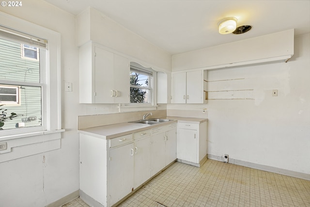 kitchen with sink and white cabinets