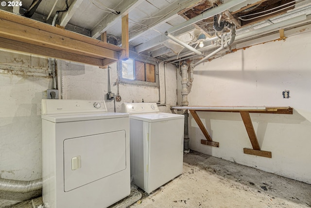 clothes washing area featuring washing machine and clothes dryer