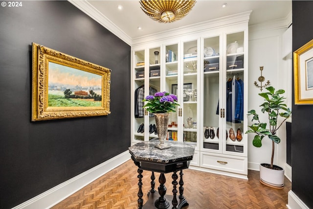 mudroom featuring parquet flooring and crown molding