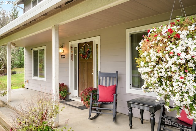 property entrance with covered porch