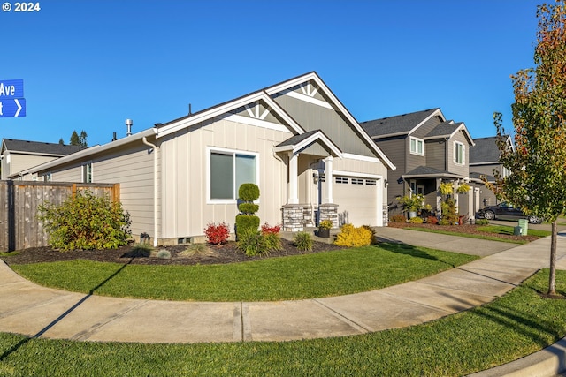 view of front of home featuring a garage and a front lawn