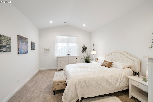 bedroom featuring carpet and vaulted ceiling