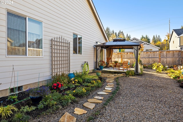 view of yard featuring a patio and a gazebo