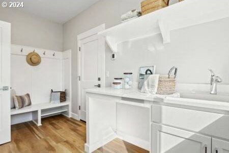 mudroom with light hardwood / wood-style floors