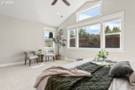 carpeted bedroom featuring ceiling fan and high vaulted ceiling