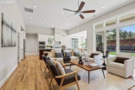 interior space with ceiling fan