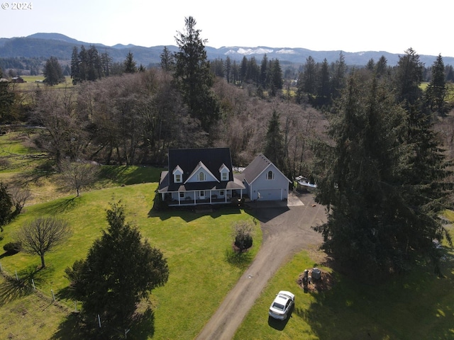 birds eye view of property with a mountain view