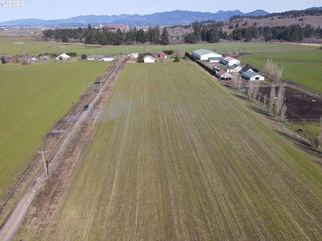 aerial view with a mountain view and a rural view