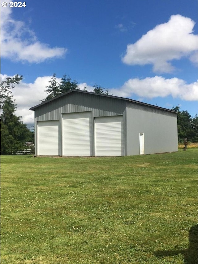 garage featuring a yard