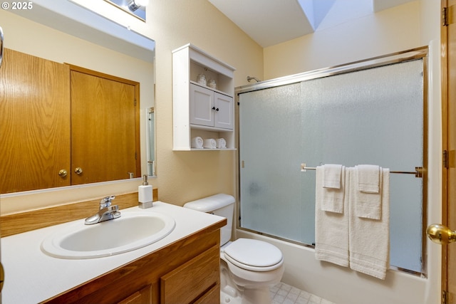 full bathroom with vanity, toilet, and bath / shower combo with glass door