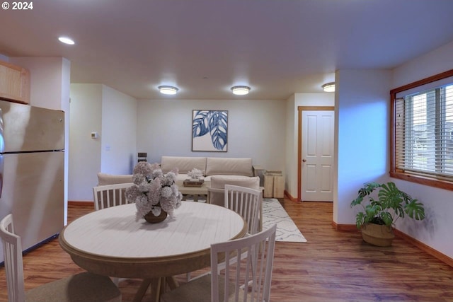 dining room with hardwood / wood-style flooring