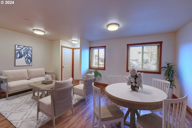 dining room with hardwood / wood-style flooring